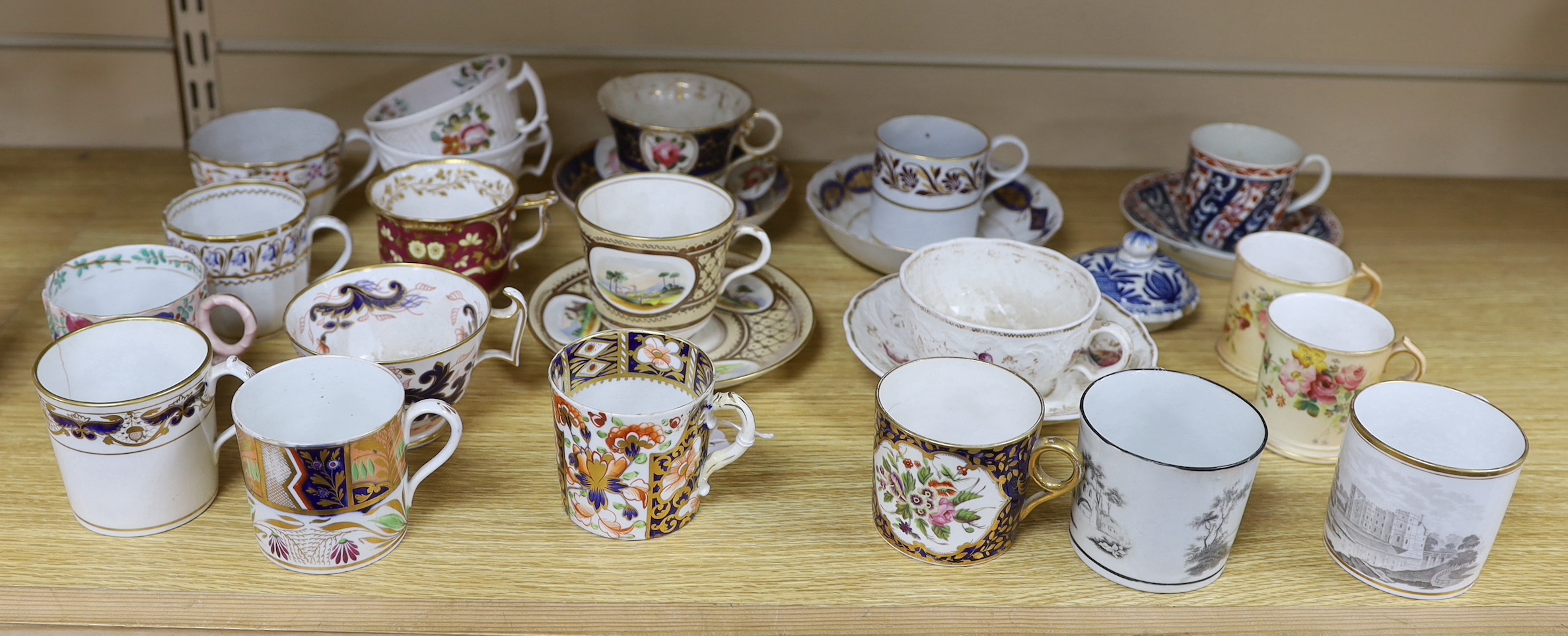 A collection of 18th and 19th century English and continental tea and coffee cups some with saucers, including a Worcester Queen Charlotte pattern coffee cup and saucer